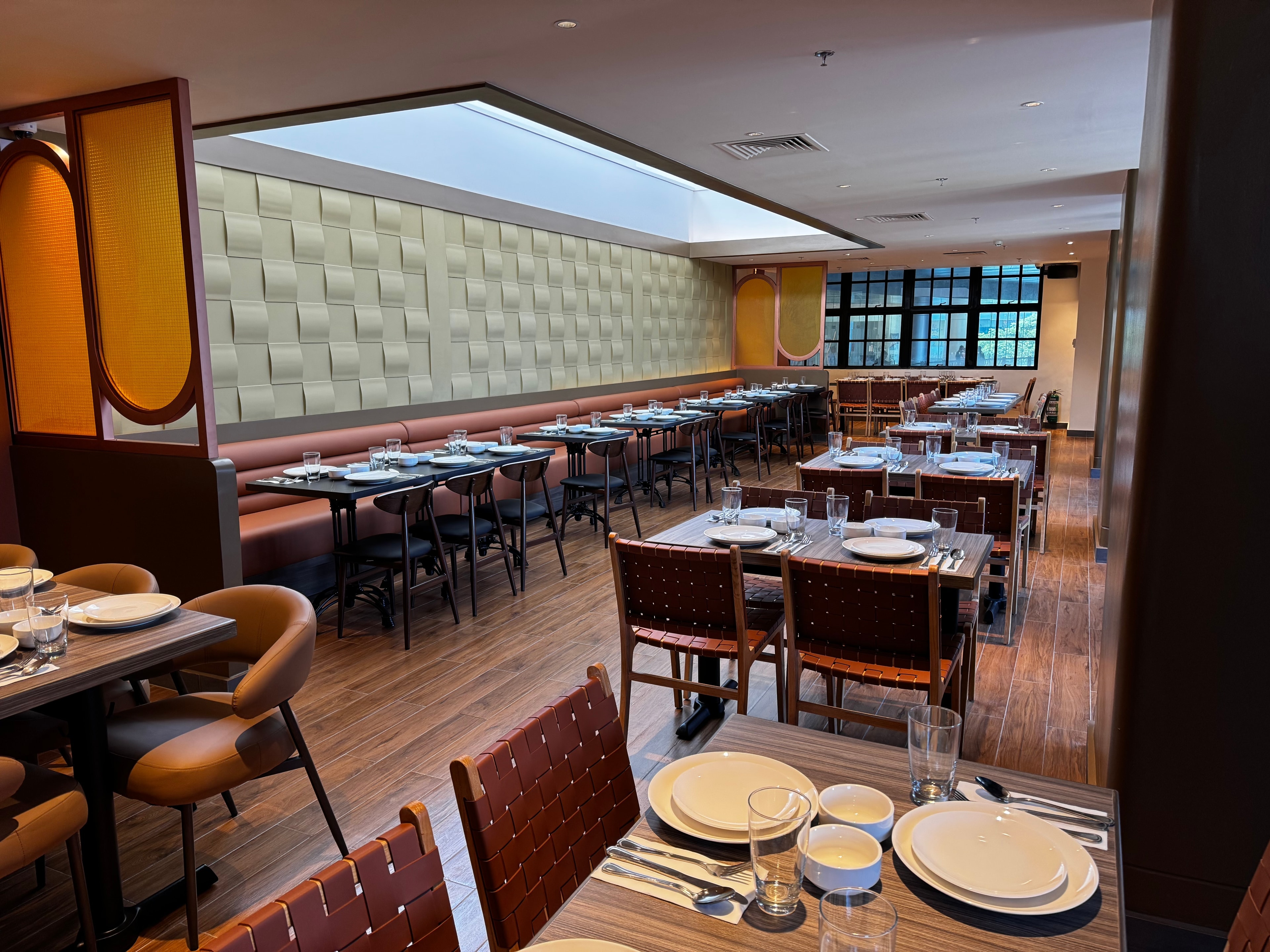 Completed restaurant interior showing premium finishes, custom millwork, and dining environment