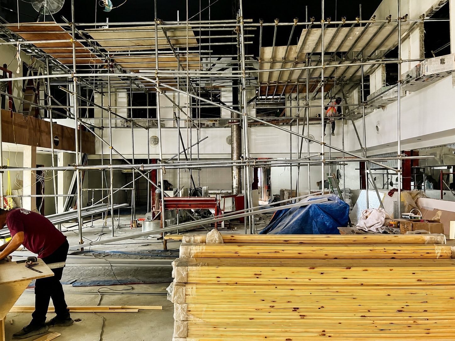 Active construction site with scaffolding — project management in progress
